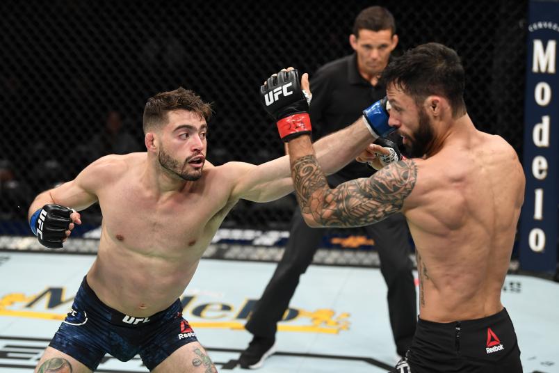 ATLANTA, GA - APRIL 13: (L-R) Randy Costa punches Brandon Davis in their bantamweight bout during the UFC 236 event at State Farm Arena on April 13, 2019 in Atlanta, Georgia. (Photo by Josh Hedges/Zuffa LLC/Zuffa LLC via Getty Images)