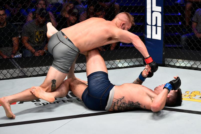 LAS VEGAS, NV - JULY 09: (L-R) Jonathan Pearce punches Jacob Rosales in their lightweight bout during Dana White's Contender Series at the UFC Apex on July 9, 2019 in Las Vegas, Nevada. (Photo by Chris Unger/DWCS LLC)