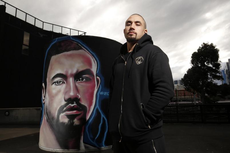 Robert Whittaker In Front of His Marvel Stadium Mural (Photo by Darrian Traynor for Zuffa LLC)