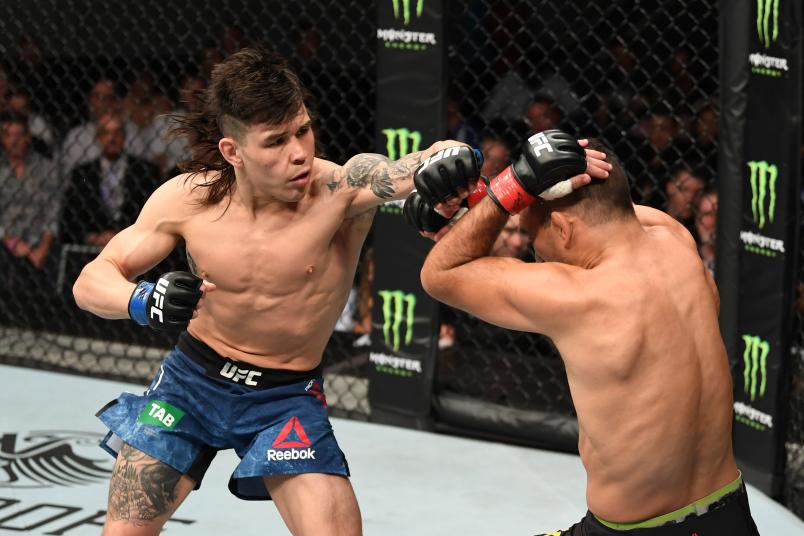 MELBOURNE, AUSTRALIA - FEBRUARY 10: (L-R) Ricky Simon punches Rani Yahya of Brazil in their bantamweight bout during the UFC 234 at the Rod Laver Arena on February 10, 2019 in the Melbourne, Australia. (Photo by Jeff Bottari/Zuffa LLC/Zuffa LLC via Getty)
