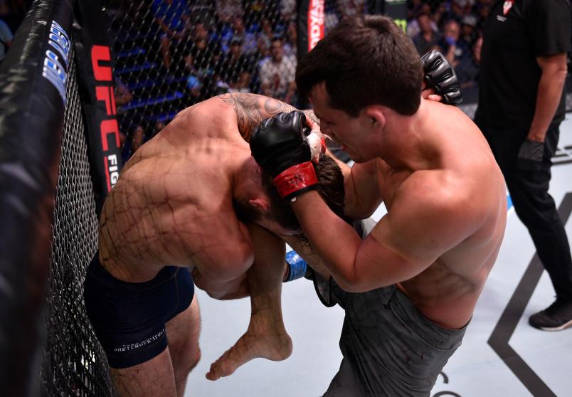 LAS VEGAS, NV - JULY 23: (R-L) Billy Quarantillo knees Kamuela Kirk in their featherweight bout during Dana White's Contender Series at the UFC Apex on July 23, 2019 in Las Vegas, Nevada. (Photo by Chris Unger/DWCS LLC)