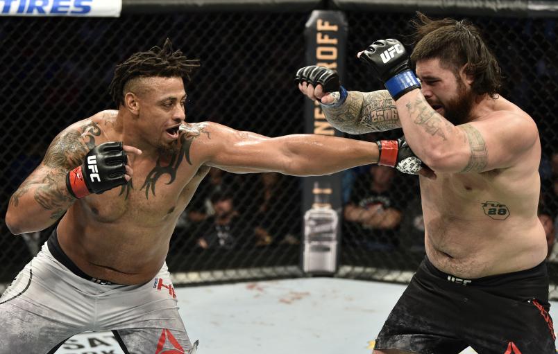 BOSTON, MASSACHUSETTS - OCTOBER 18: (L-R) Greg Hardy punches Ben Sosoli in their heavyweight bout during the UFC Fight Night event at TD Garden on October 18, 2019 in Boston, Massachusetts. (Photo by Chris Unger/Zuffa LLC via Getty Images)