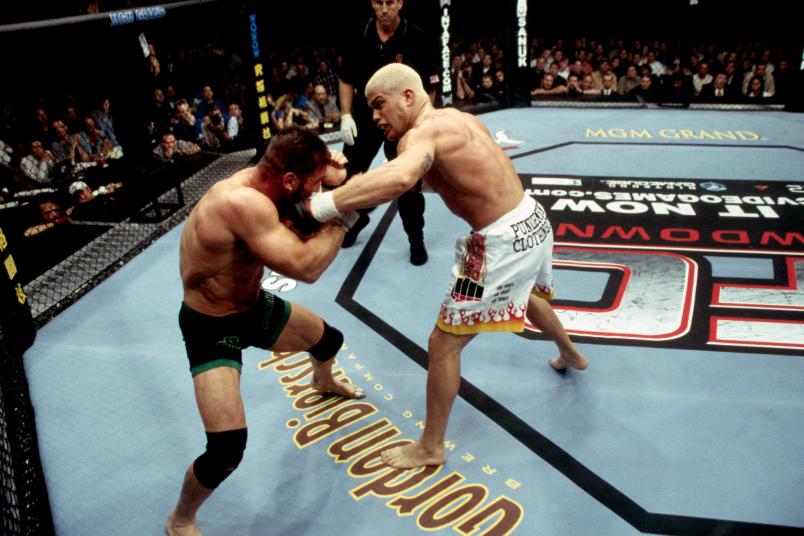 LAS VEGAS, NV - NOVEMBER 22: (R-L) Tito Ortiz punches Ken Shamrock during their light heavyweight championship bout at UFC 40 inside the MGM Grand Garden Arena on November 22, 2002 in Las Vegas, Nevada. (Photo by Josh Hedges/Zuffa LLC/Zuffa LLC via Getty Images)
