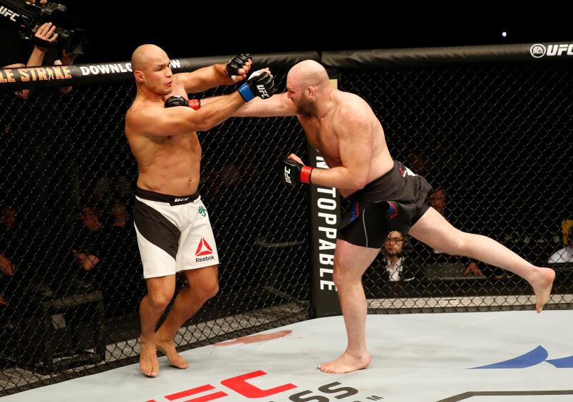 ZAGREB, CROATIA - APRIL 10: (R-L) Ben Rothwell punches Junior Dos Santos in their heavyweight bout during the UFC Fight Night event at the Arena Zagreb on April 10, 2016 in Zagreb, Croatia. (Photo by Srdjan Stevanovic/Zuffa LLC/Zuffa LLC via Getty Images)