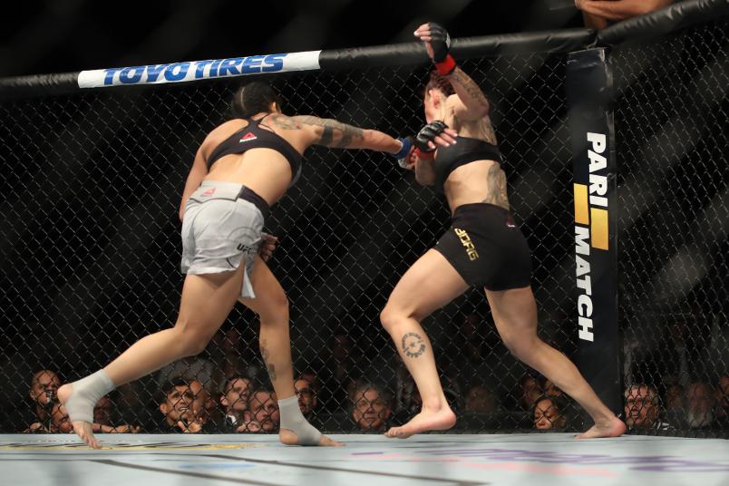 Amanda Nunes of Brazil punches Cris Cyborg of Brazil in their women's featherweight bout during the UFC 232 event inside The Forum on December 29, 2018 in Inglewood, California. (Photo by Christian Petersen/Zuffa LLC via Getty Images)