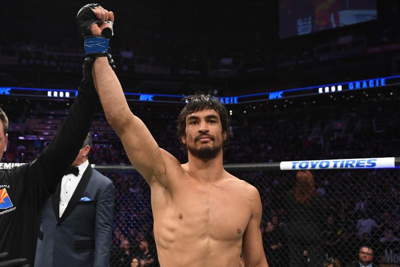 Kron Gracie of Brazil celebrates his submission victory over Alex Caceres in their featherweight bout during the UFC Fight Night event at Talking Stick Resort Arena on February 17, 2019 in Phoenix, Arizona. (Photo by Josh Hedges/Zuffa LLC via Getty Images)