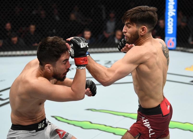 WICHITA, KS - MARCH 09: (R-L) Matt Schnell punches Louis Smolka in their bantamweight bout during the UFC Fight Night event at Intrust Bank Arena on March 9, 2019 in Wichita, Kansas. (Photo by Josh Hedges/Zuffa LLC)