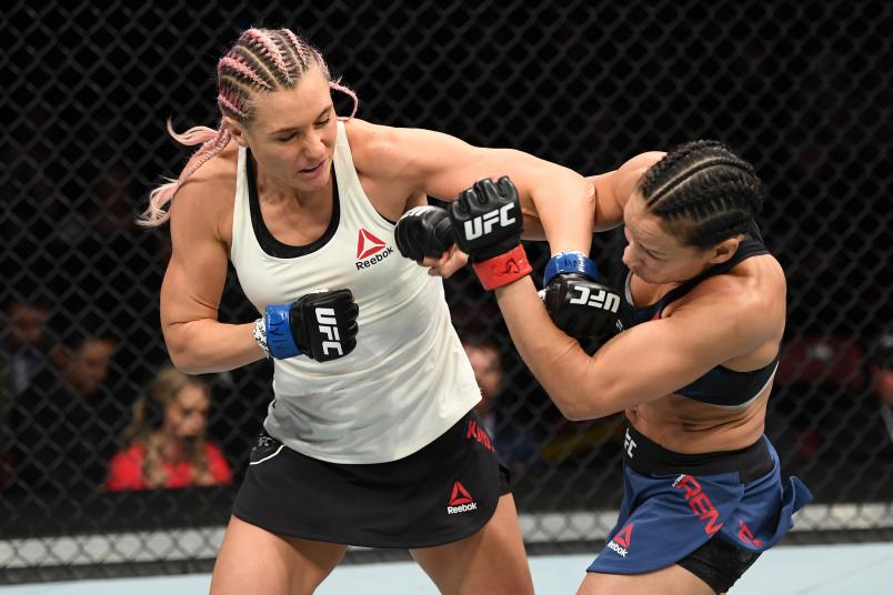 Yana Kunitskaya of Russia punches Marion Reneau in their women's bantamweight bout during the UFC Fight Night event at Intrust Bank Arena on March 9, 2019 in Wichita, Kansas. (Photo by Josh Hedges/Zuffa LLC via Getty Images)