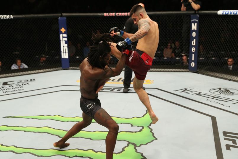 ROCHESTER, NY - MAY 18: (R-L) Charles Jourdain of Canada delivers a flying knee against Desmond Green in their lightweight bout during the UFC Fight Night event at Blue Cross Arena on May 18, 2019 in Rochester, New York. (Photo by Michael Owens/Zuffa LLC/Zuffa LLC via Getty Images)