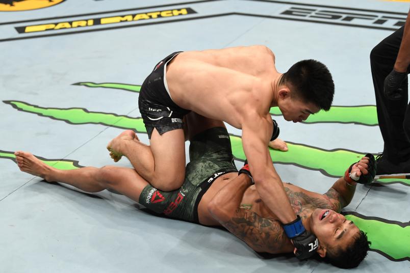 Song Yadong of China finishes Alejandro Perez of Mexico in their bantamweight fight during the UFC 239 event at T-Mobile Arena on July 6, 2019 in Las Vegas, Nevada. (Photo by Josh Hedges/Zuffa LLC)