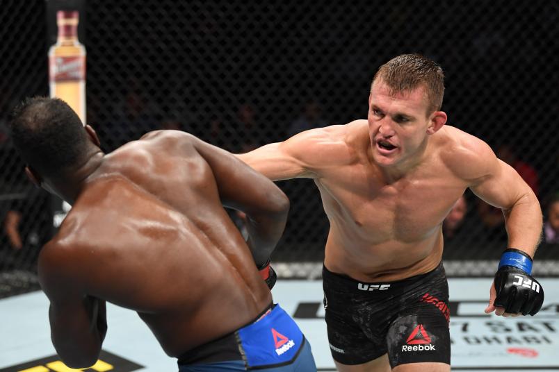 ANAHEIM, CALIFORNIA - AUGUST 17: (R-L) Ian Heinisch punches Derek Brunson in their middleweight bout during the UFC 241 event at the Honda Center on August 17, 2019 in Anaheim, California. (Photo by Josh Hedges/Zuffa LLC/Zuffa LLC via Getty Images)