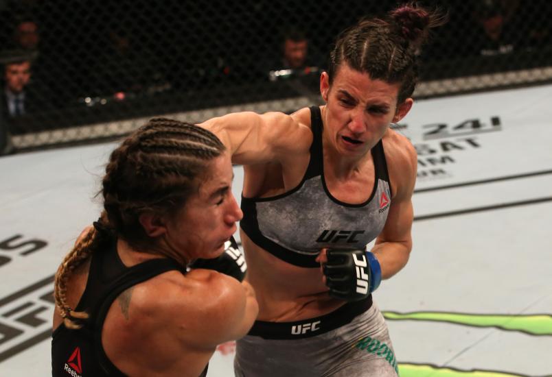 Marina Rodriguez of Brazil punches Tecia Torres in their strawweight fight during the UFC Fight Night event at Antel Arena on August 10, 2019 in Montevideo, Uruguay. (Photo by Alexandre Schneider/Zuffa LLC)
