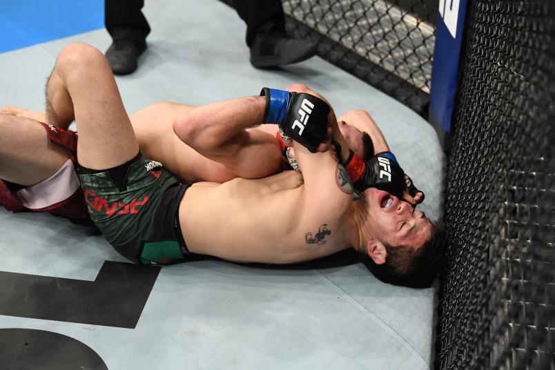 MEXICO CITY, MEXICO - SEPTEMBER 21: (R-L) Brandon Moreno of Mexico attempts to submit Askar Askarov of Russia in their flyweight bout during the UFC Fight Night event on September 21, 2019 in Mexico City, Mexico. (Photo by Josh Hedges/Zuffa LLC/Zuffa LLC via Getty Images)