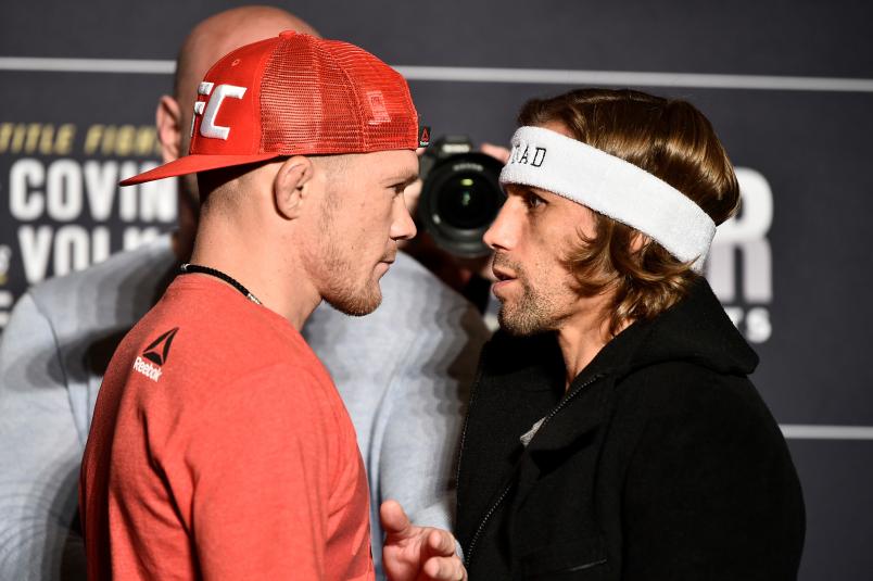 Petr Yan of Russia and Urijah Faber face off during the UFC 245 Ultimate Media Day at the Red Rock Casino Resort on December 12, 2019 in Las Vegas, Nevada. (Photo by Chris Unger/Zuffa LLC via Getty Images)