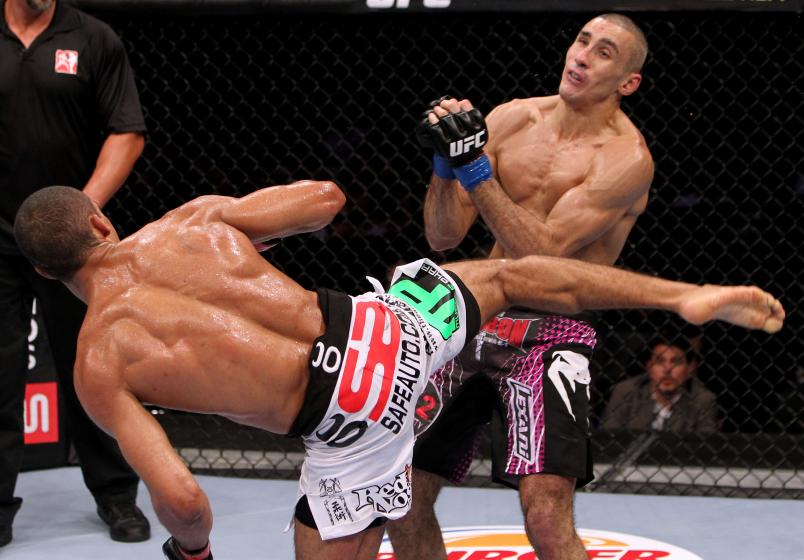 Edson Barboza (L) knocks out Terry Etim (R) with a spinning back kick in a lightweight bout during UFC 142 at HSBC Arena on January 14, 2012 in Rio de Janeiro, Brazil. (Photo by Josh Hedges/Zuffa LLC via Getty Images)