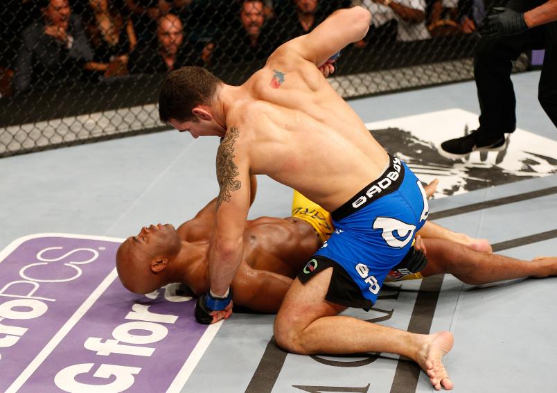 LAS VEGAS, NV - JULY 06: (R-L) Chris Weidman punches Anderson Silva in their UFC middleweight championship fight during the UFC 162 event inside the MGM Grand Garden Arena on July 6, 2013 in Las Vegas, Nevada. (Photo by Josh Hedges/Zuffa LLC/Zuffa LLC via Getty Images)