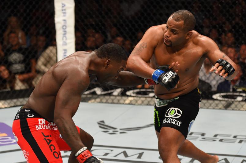 Daniel Cormier punches Anthony Johnson in their UFC light heavyweight championship bout during the UFC 187 event at the MGM Grand Garden Arena on May 23, 2015 in Las Vegas, Nevada. (Photo by Josh Hedges/Zuffa LLC via Getty Images)