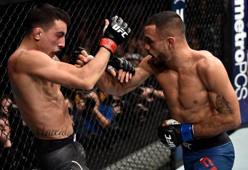Rob Font punches Thomas Almeida of Brazil in their bantamweight bout during the UFC 220 event at TD Garden on January 20, 2018 in Boston, Massachusetts. (Photo by Jeff Bottari/Zuffa LLC via Getty Images)