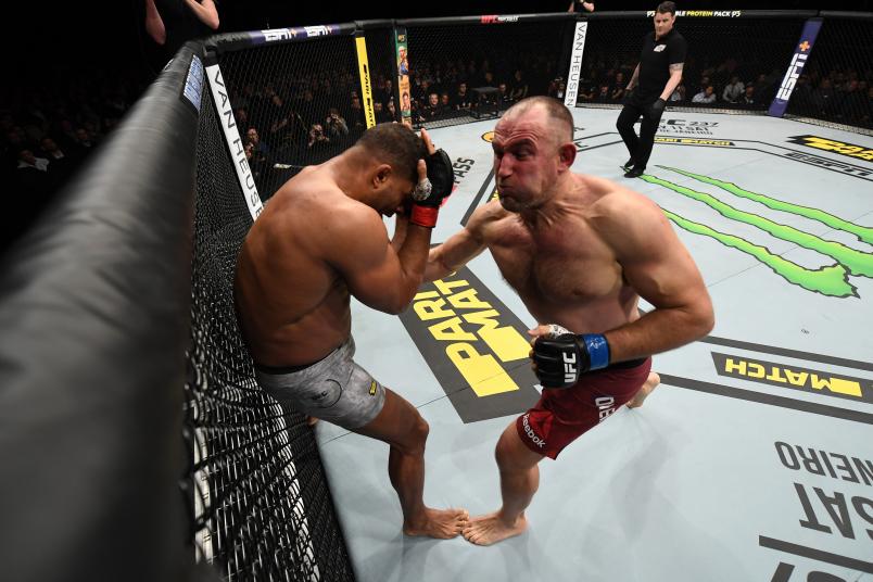 SAINT PETERSBURG, RUSSIA - APRIL 20: (R-L) Aleksei Oleinik of Russia punches Alistair Overeem of The Netherlands in their heavyweight bout during the UFC Fight Night event at Yubileyny Sports Palace on April 20, 2019 in Saint Petersburg, Russia. (Photo by Jeff Bottari/Zuffa LLC/Zuffa LLC via Getty Images)