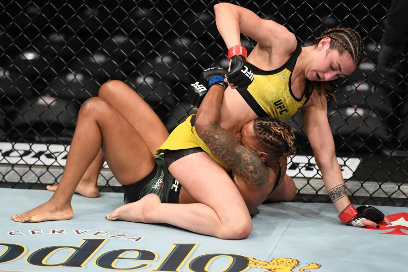 ANAHEIM, CALIFORNIA - AUGUST 17: Sabina Mazo of Colombia (top) punches Shana Dobson in their women's flyweight bout during the UFC 241 event at the Honda Center on August 17, 2019 in Anaheim, California. (Photo by Josh Hedges/Zuffa LLC/Zuffa LLC via Getty Images)