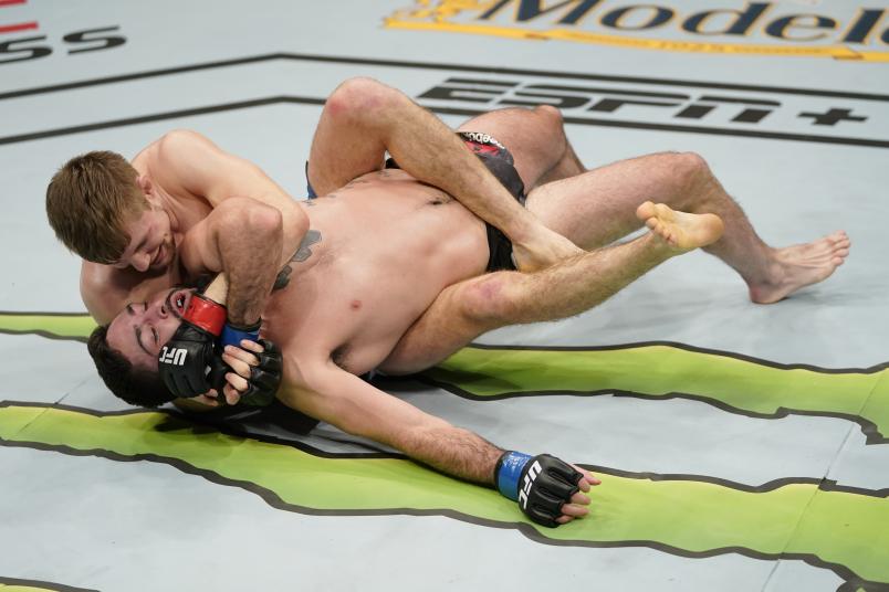Bryce Mitchell grapples with Matt Sayles in their featherweight bout during the UFC Fight Night event at Capital One Arena on December 07, 2019 in Washington, DC. (Photo by Jeff Bottari/Zuffa LLC via Getty Images)