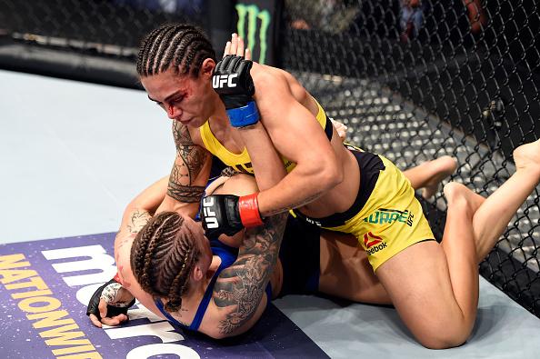 CLEVELAND, OH - SEPTEMBER 10: (R-L) Jessica Andrade of Brazil takes down Joanne Calderwood of Scotland in their strawweight bout during the UFC 203 event at Quicken Loans Arena on September 10, 2016 in Cleveland, Ohio. (Photo by Josh Hedges/Zuffa LLC/Zuf