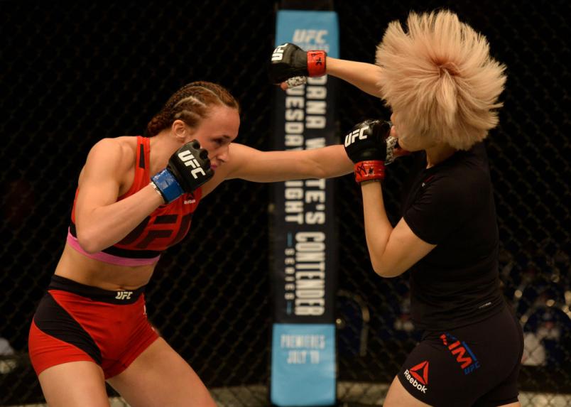 SINGAPORE - JUNE 17: (L-R) Lucie Pudilova punches Ji Yeon Kim of South Korea in their women's bantamweight bout during the UFC Fight Night event at the Singapore Indoor Stadium on June 17, 2017 in Singapore. (Photo by Brandon Magnus/Zuffa LLC)