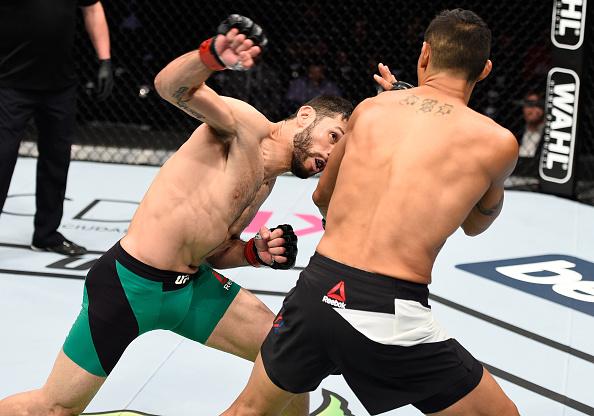 MEXICO CITY, MEXICO - NOVEMBER 05: (L-R) Marco Polo Reyes of Mexico punches Jason Novelli of the United States in their lightweight bout during the UFC Fight Night event at Arena Ciudad de Mexico on November 5, 2016 in Mexico City, Mexico. (Photo by Jeff