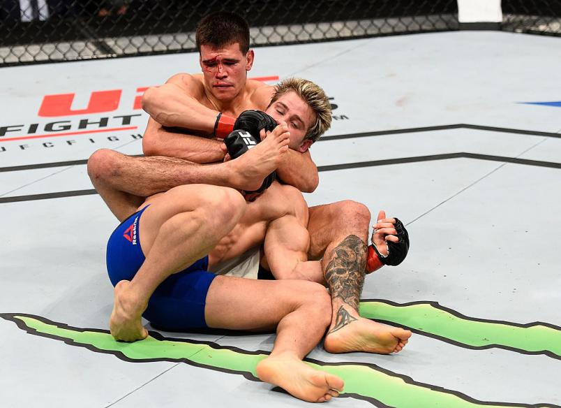 SACRAMENTO, CA - DECEMBER 17: (L-R) Mickey Gall attempts to secure a rear choke submission against Sage Northcutt in their welterweight bout during the UFC Fight Night event inside the Golden 1 Center Arena on December 17, 2016 in Sacramento, California.