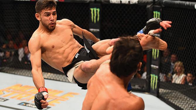 Yair Rodriguez of Mexico kicks Andre Fili in their featherweight bout during the UFC 197 event inside MGM Grand Garden Arena on April 23, 2016 in Las Vegas, Nevada. (Photo by Josh Hedges/Zuffa LLC/Zuffa LLC via Getty Images)
