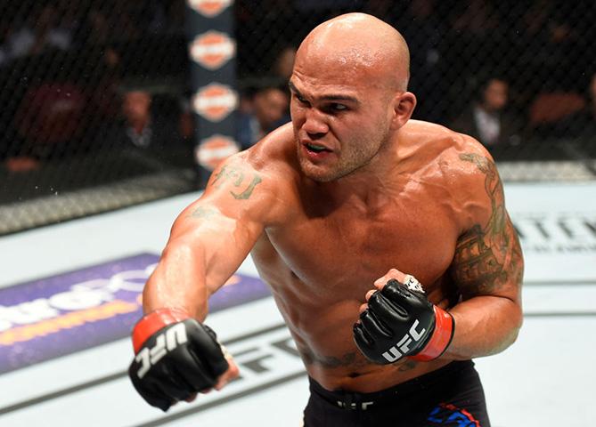 ANAHEIM, CA - JULY 29: (R-L) Robbie Lawler punches Donald Cerrone in their welterweight bout during the UFC 214 event inside the Honda Center on July 29, 2017 in Anaheim, California. (Photo by Josh Hedges/Zuffa LLC/Zuffa LLC via Getty Images)