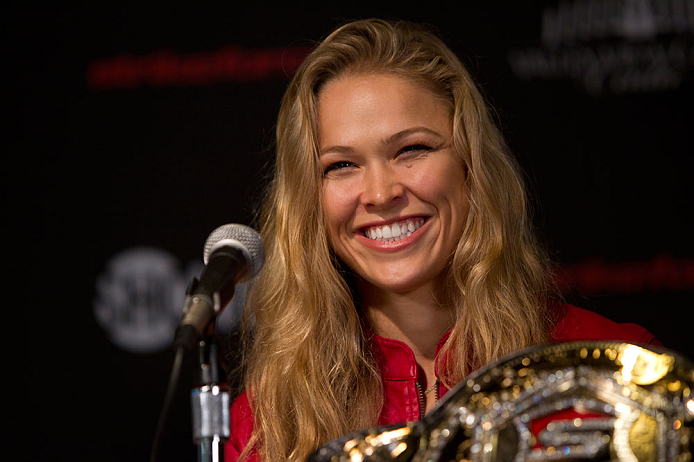 SAN DIEOGO, CA - AUGUST 16: Ronda Rousey interacts with media and fans during the Strikeforce press conference at the Valley View Casino Center on August 16, 2012 in San Diego, Calofornia. (Photo by Esther Lin/Forza LLC)