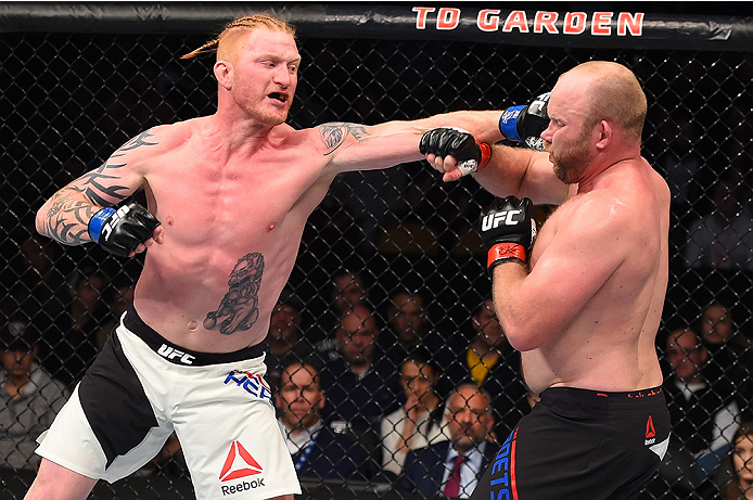 BOSTON, MA - JANUARY 17: (L-R) Ed Herman punches Tim Boetsch in their light heavyweight bout during the UFC Fight Night event inside TD Garden on January 17, 2016 in Boston, Massachusetts. (Photo by Jeff Bottari/Zuffa LLC/Zuffa LLC via Getty Images)