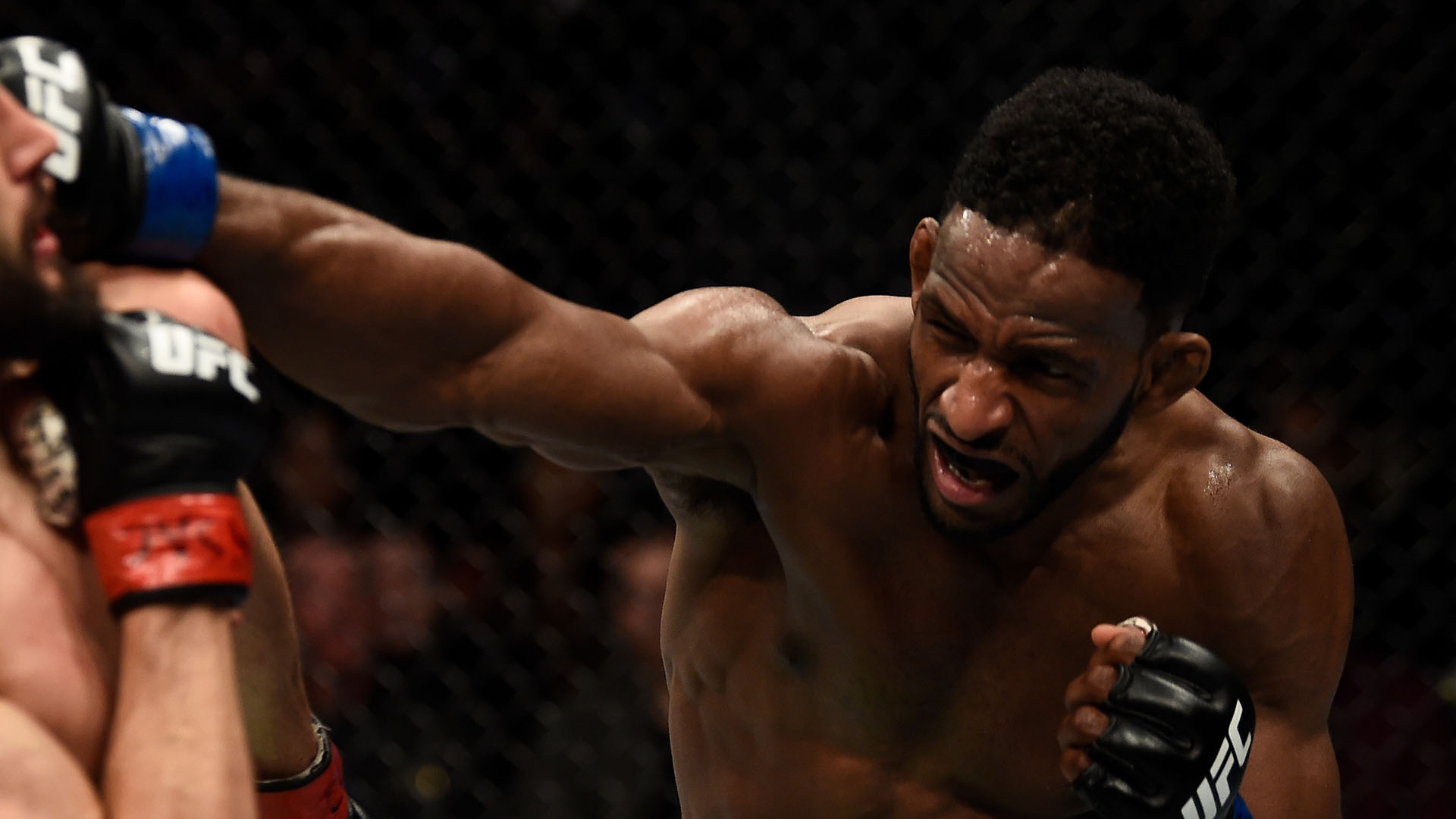 Neil Magny punches Carlos Condit in their welterweight bout during the UFC 219 event inside T-Mobile Arena on December 30, 2017 in Las Vegas, Nevada. (Photo by Jeff Bottari/Zuffa LLC)