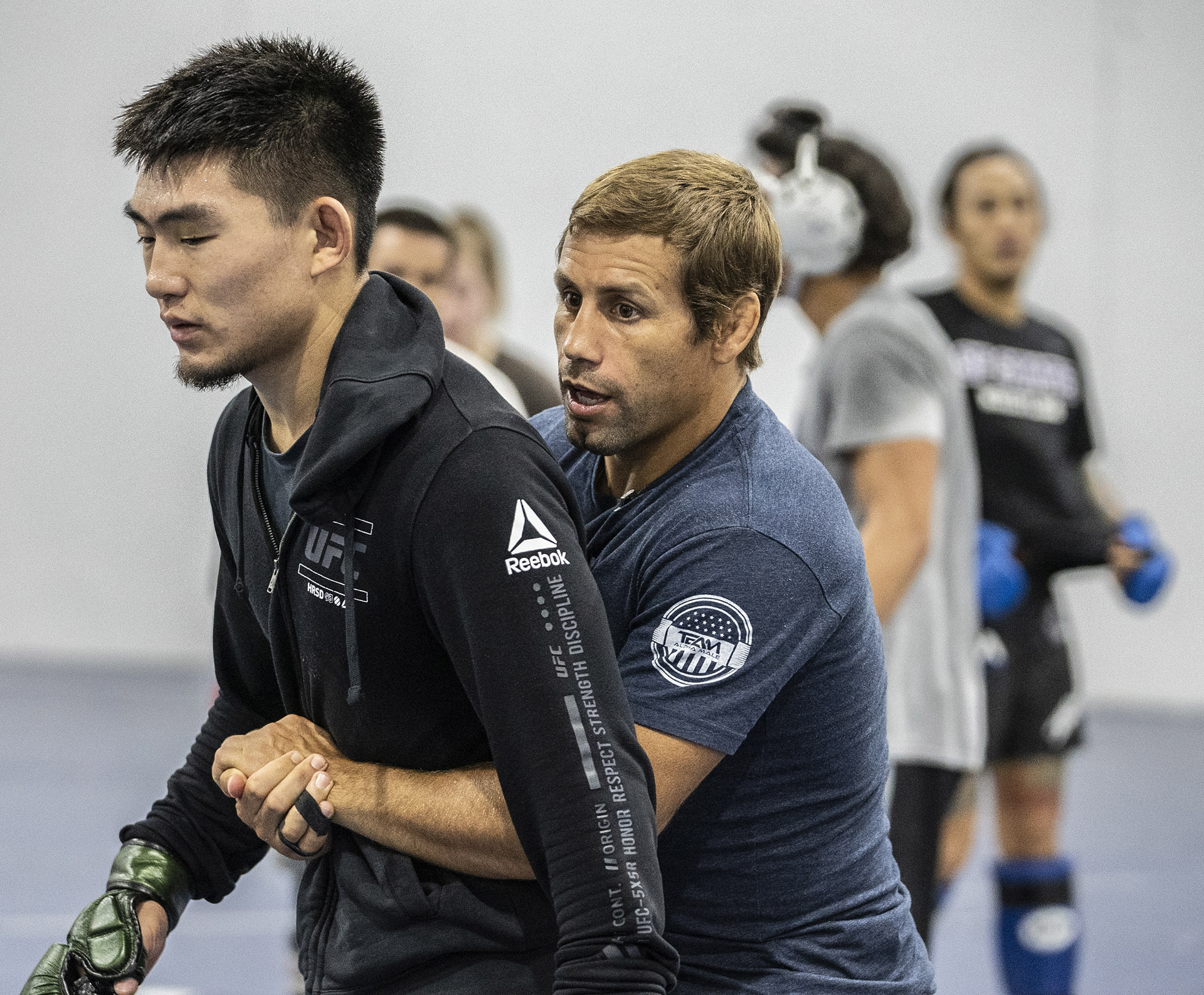 Song Yadong gets instruction from coach Urijah Faber at Team Alpha Male, July 2021 (Photo by Juan Cardenas/Zuffa LLC)