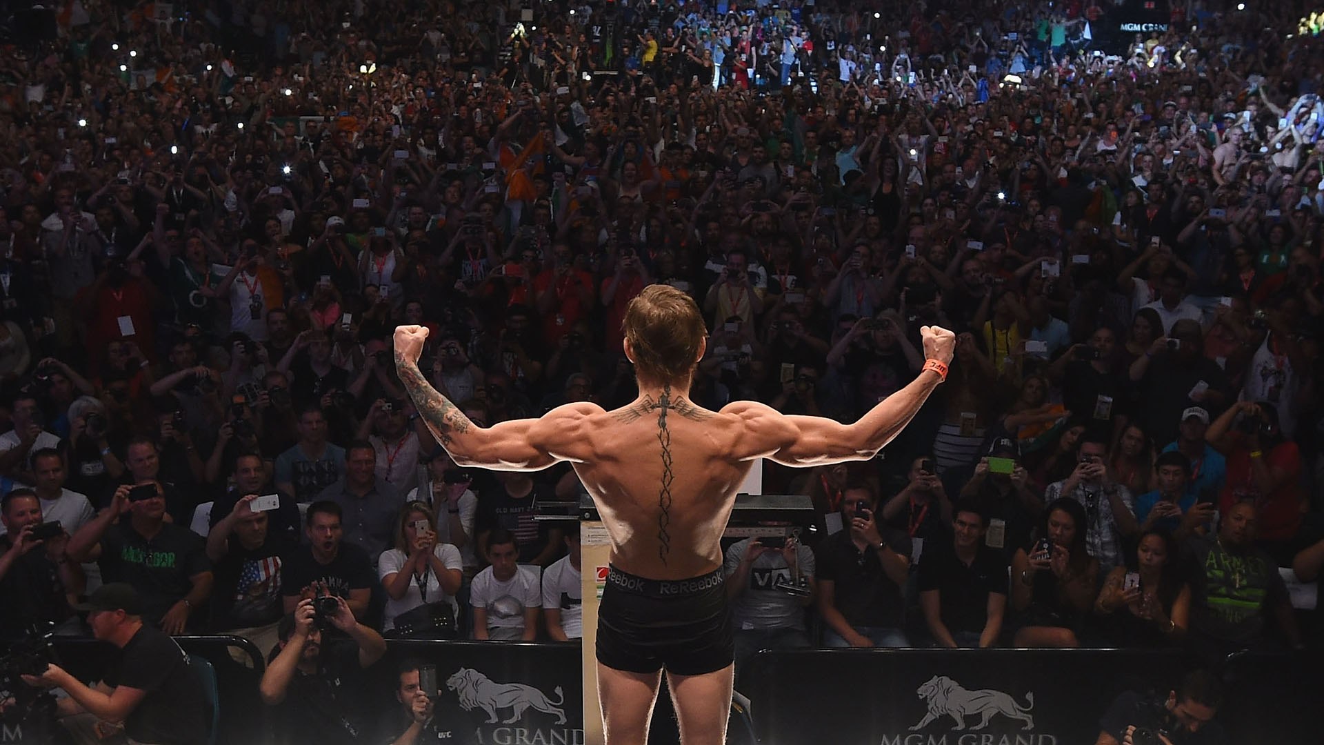 Conor McGregor steps onto the scale during the UFC 189 weigh-in inside MGM Grand Garden Arena on July 10, 2015 in Las Vegas, Nevada. (Photo by Zuffa LLC)