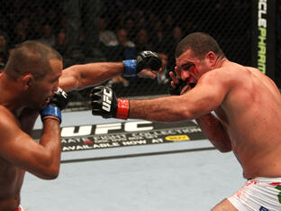 Mauricio Rua and Dan Henderson trade punches during the UFC 139 event