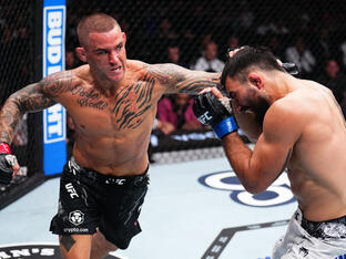 Dustin Poirier punches Benoit Saint Denis of France in a lightweight fight during the UFC 299 event at Kaseya Center on March 09, 2024 in Miami, Florida. (Photo by Chris Unger/Zuffa LLC)