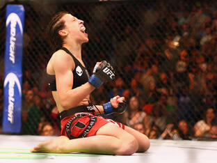 Joanna Jedrzejczyk celebrates her TKO against Carla Esparza in the Women's Strawweight bout during the UFC 185 event at American Airlines Center on March 14, 2015 in Dallas, Texas. (Photo by Ronald Martinez/Getty Images)