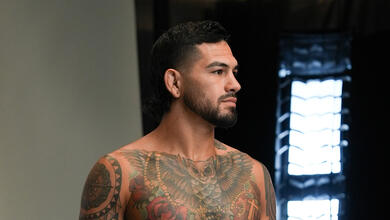 UFC middleweight Anthony Hernandez stands in front of a white backdrop and lights for a portrait