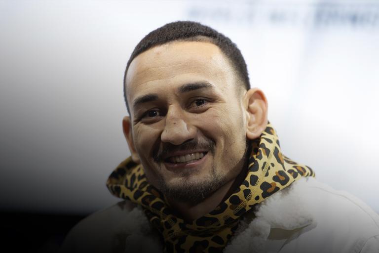Former UFC featherweight champion Max Holloway smiles at the UFC 245 press conference.