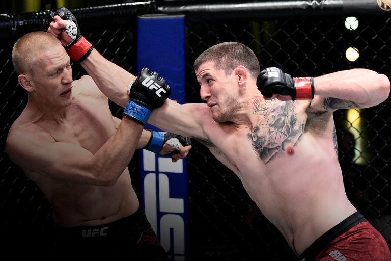 Marc-Andre Barriault of Canada punches Oskar Piechota of Poland in their middleweight bout during the UFC Fight Night event at UFC APEX on June 20, 2020 in Las Vegas, Nevada. (Photo by Chris Unger/Zuffa LLC)