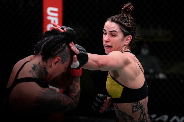 Norma Dumont of Brazil punches Ashlee Evans-Smith in their women's bantamweight bout during the UFC Fight Night at UFC APEX on November 28, 2020 in Las Vegas, Nevada. (Photo by Chris Unger/Zuffa LLC)