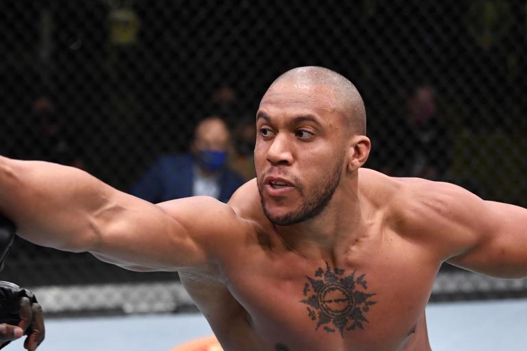 Ciryl Gane of France punches Jairzinho Rozenstruik of Suriname in a heavyweight bout during the UFC Fight Night event at UFC APEX on February 27, 2021 in Las Vegas, Nevada. (Photo by Jeff Bottari/Zuffa LLC)