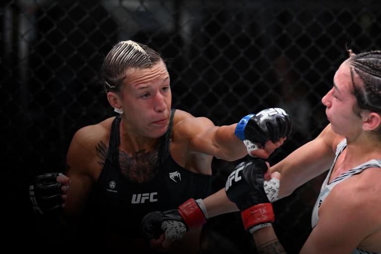 Mariya Agapova of Kazakhstan punches Sabina Mazo of Colombia in their bantamweight bout during the UFC Fight Night event at UFC APEX on October 09, 2021 in Las Vegas, Nevada. (Photo by Josh Hedges/Zuffa LLC)