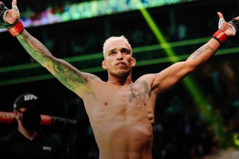 Charles Oliveira of Brazil enters the octagon for his lightweight title fight against Dustin Poirier during the UFC 269 event at T-Mobile Arena on December 11, 2021 in Las Vegas, Nevada. (Photo by Carmen Mandato/Getty Images)