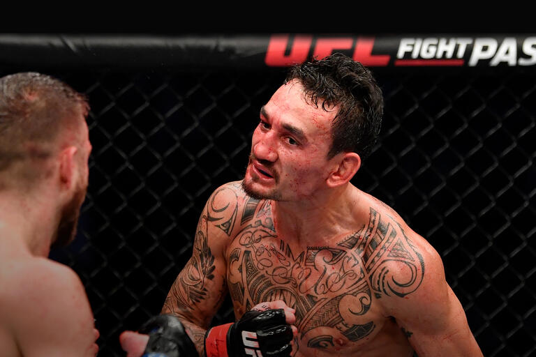 Max Holloway taunts Calvin Kattar in a featherweight bout during the UFC Fight Night event at Etihad Arena on UFC Fight Island on January 17, 2021 in Abu Dhabi, United Arab Emirates. (Photo by Jeff Bottari/Zuffa LLC)