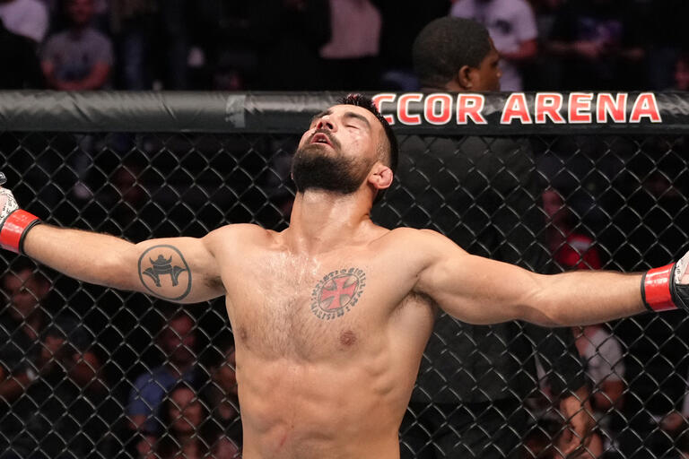 Benoit Saint Denis of France celebrates his TKO victory over Gabriel Miranda of Brazil in a lightweight fight during the UFC Fight Night event at The Accor Arena on September 03, 2022 in Paris, France. (Photo by Jeff Bottari/Zuffa LLC)