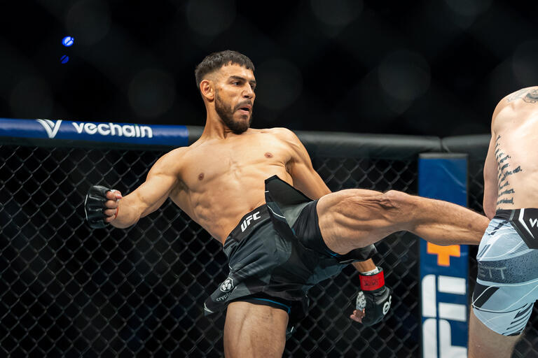 UFC featherweight Yair Rodriguez kicks Josh Emmett in their UFC 284 bout. (Photo by Nolan Walker/ Zuffa LLC)