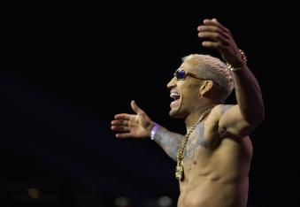 Charles Oliveira of Brazil poses on the scale during the UFC 269 ceremonial weigh-in at MGM Grand Garden Arena on December 10, 2021 in Las Vegas, Nevada. (Photo by Cooper Neill/Zuffa LLC)